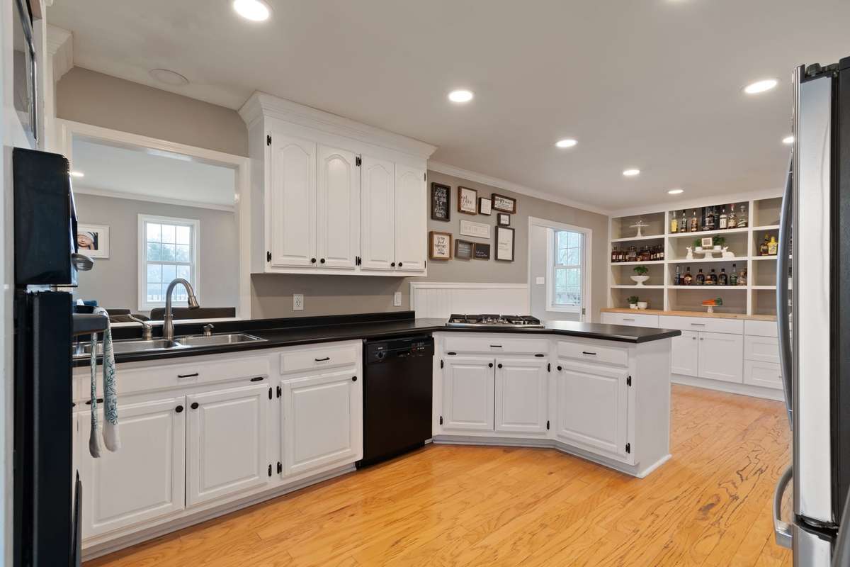 Don't miss the pull-out shelving in the pantry and under countertop