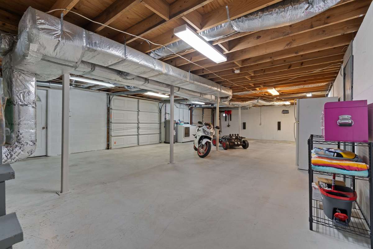 Full unfinished basement with 1 garage door for parking inside