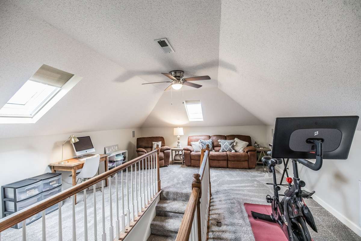 Bonus Room, what a great place to work out, homeschool, home office, or just enjoy a late night movie with the surround sound and flatscreen TV.