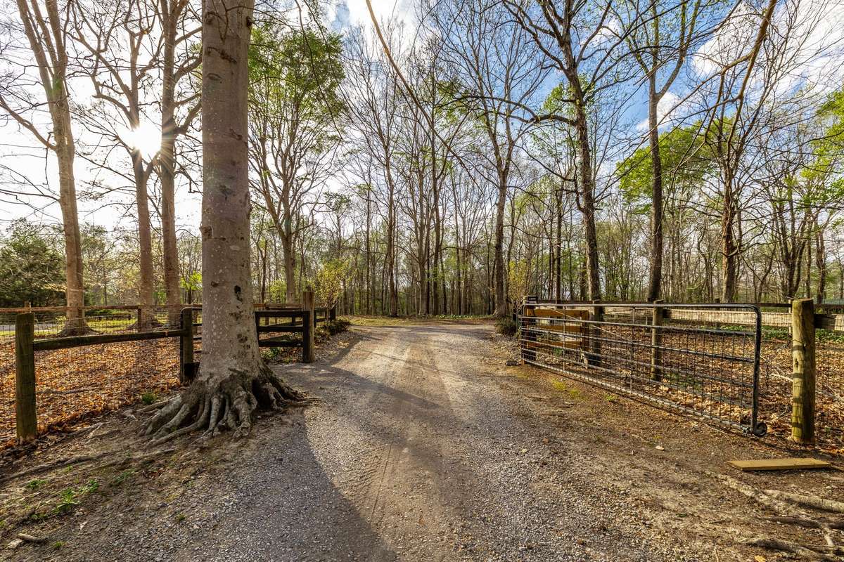 Driveway entrance with privacy gate.