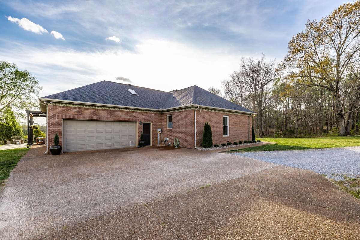 Large two car garage with storage closet and separate entrance into the mudroom and the back patio.
