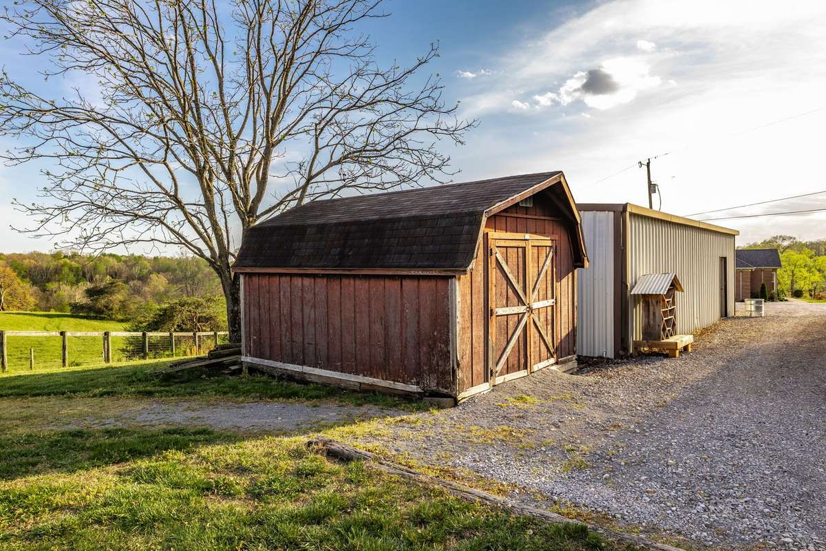 The storage building will remain and provides extra storage for needed tools, etc.