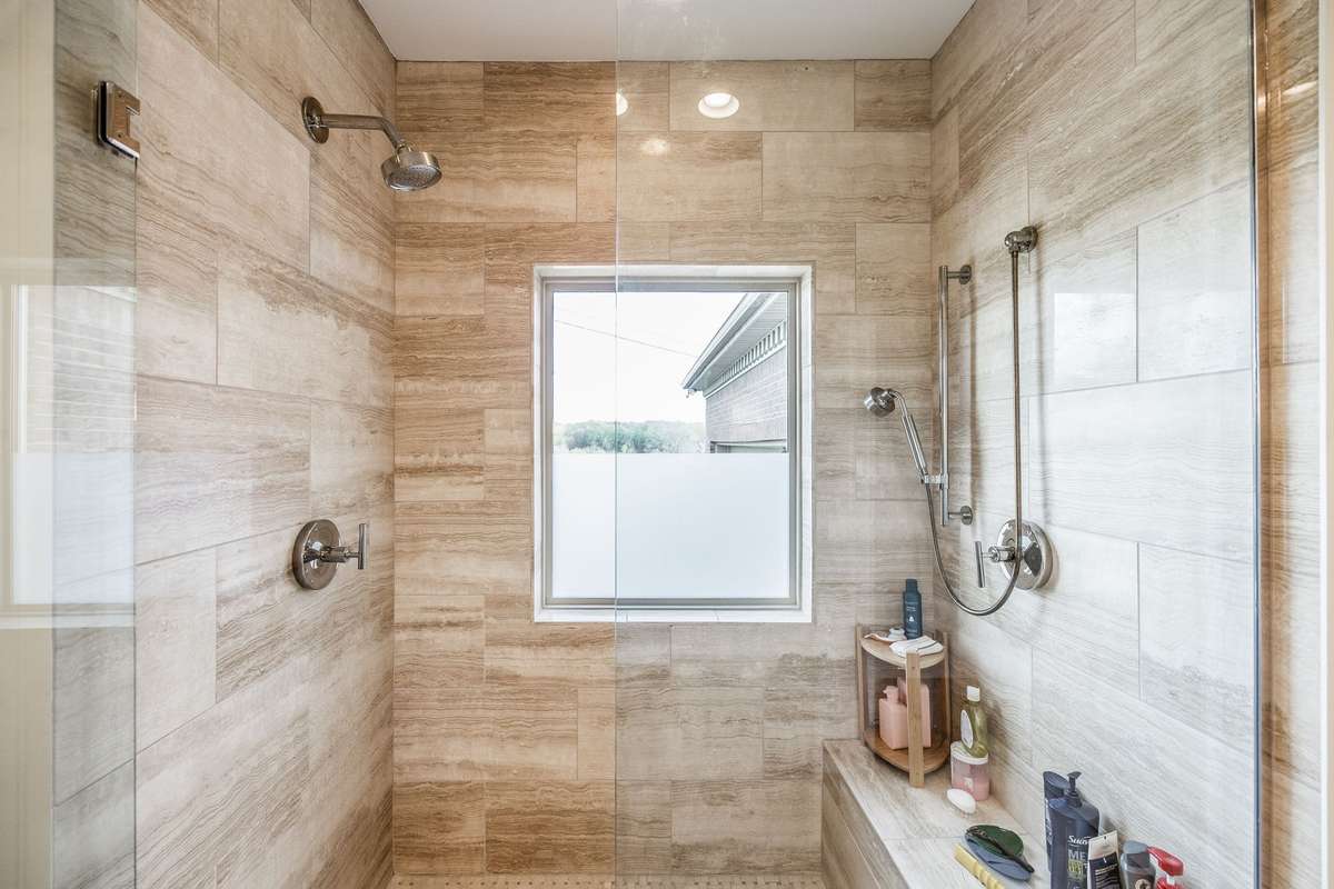 Primary bath has a large shower with dual shower heads.