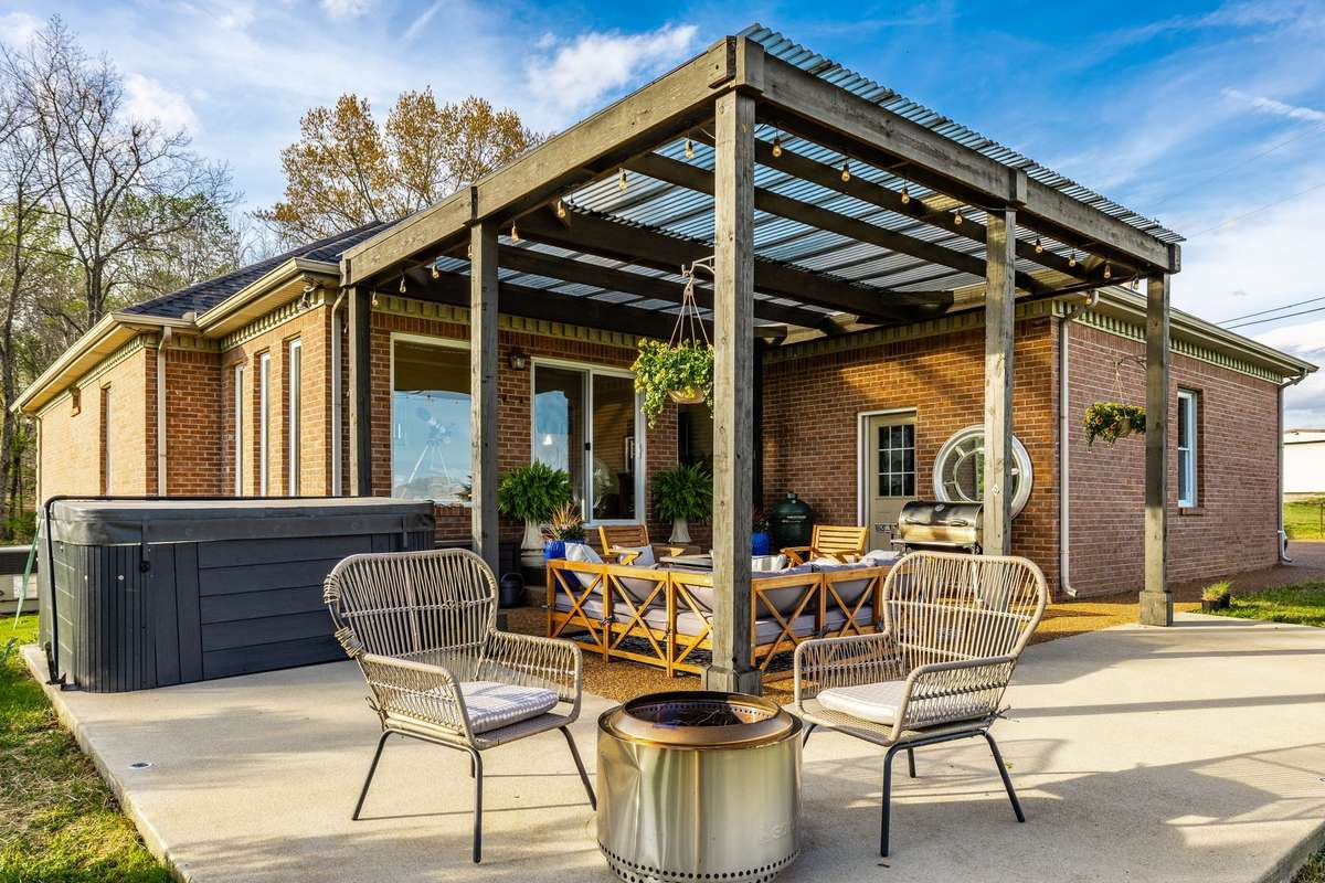 The covered patio offers endless days of enjoyment, with a hot tub, fire pit or just a nice place to sit a while, relax and enjoy the views.