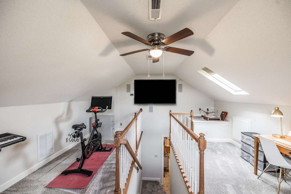 Another view of the bonus room and flat-screen TV with surround sound.