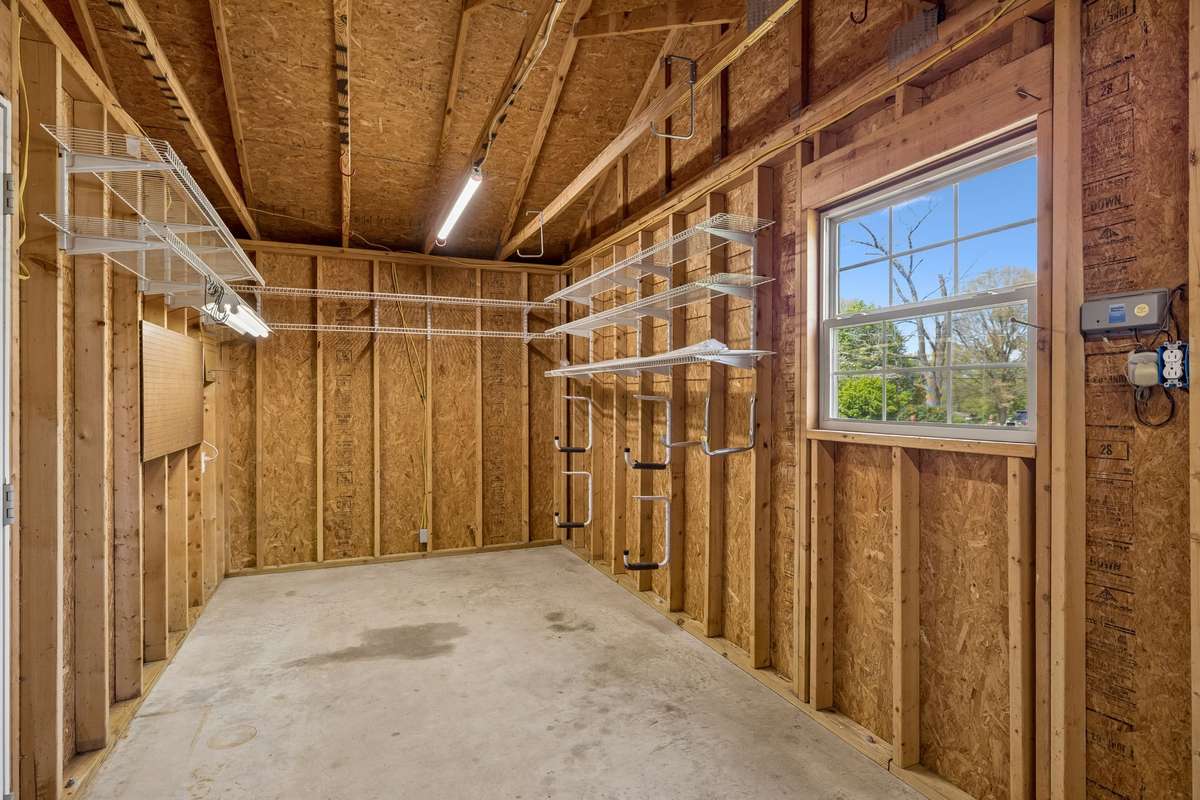 Storage area behind carport.