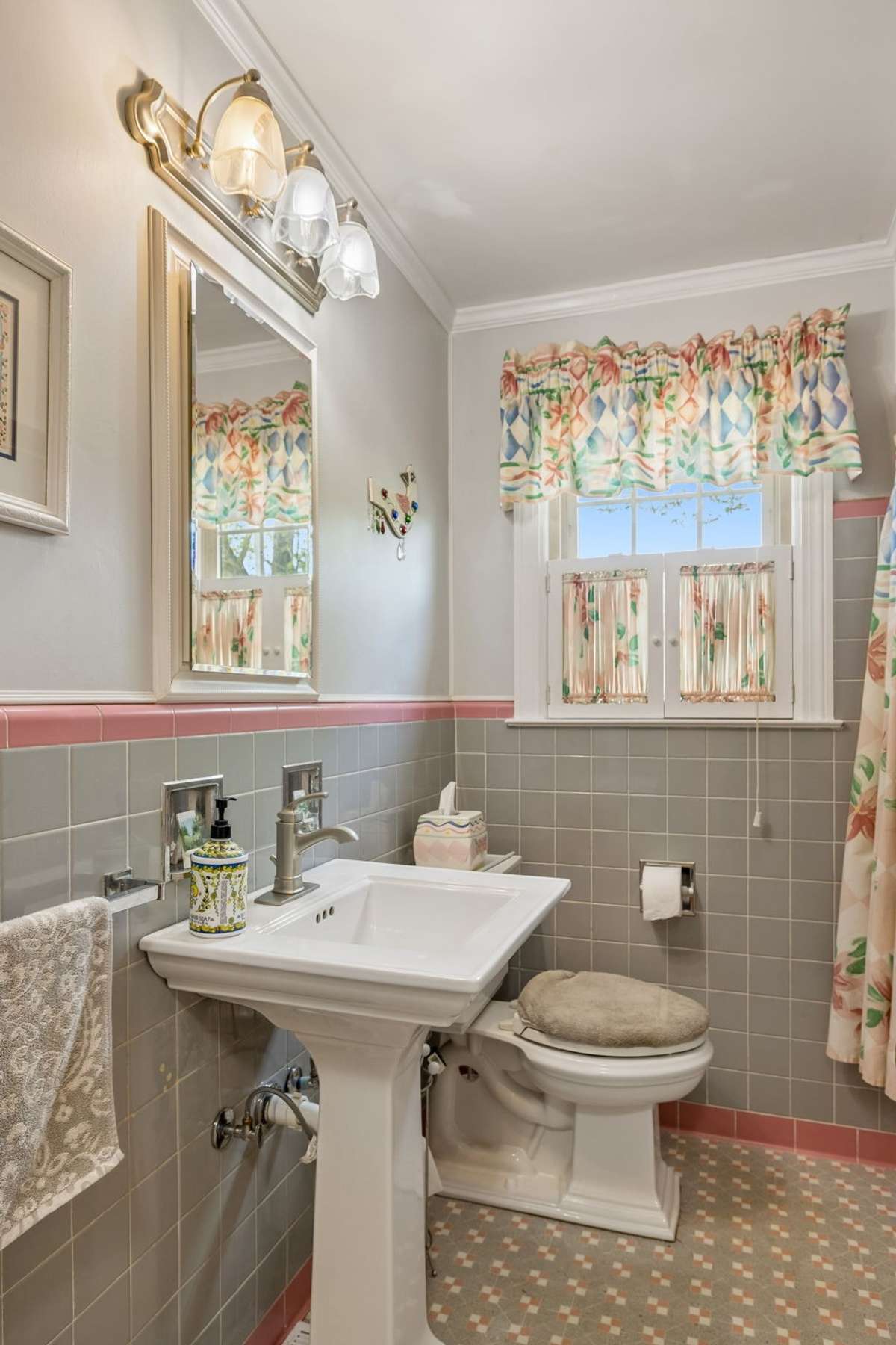 Main floor bathroom with original bathroom tile in excellent condition.