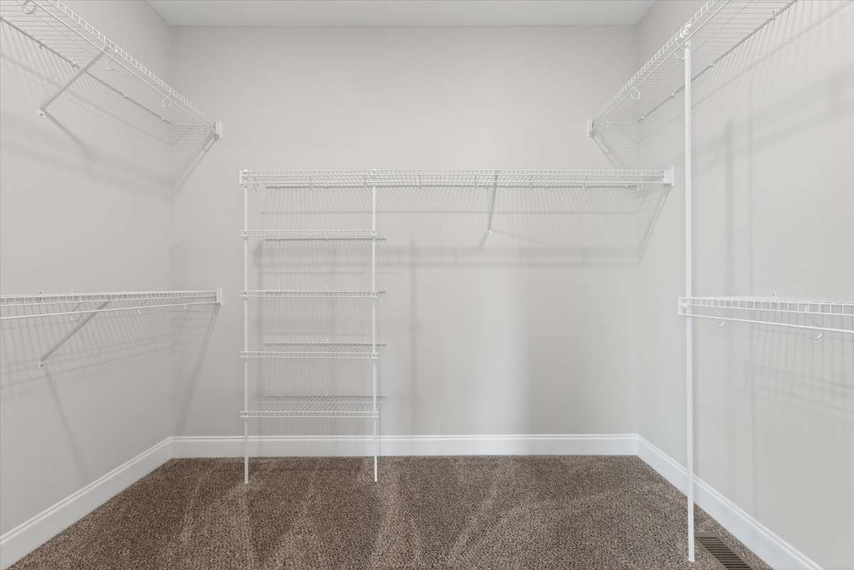 Oversized walk-in closet with built-in shelving