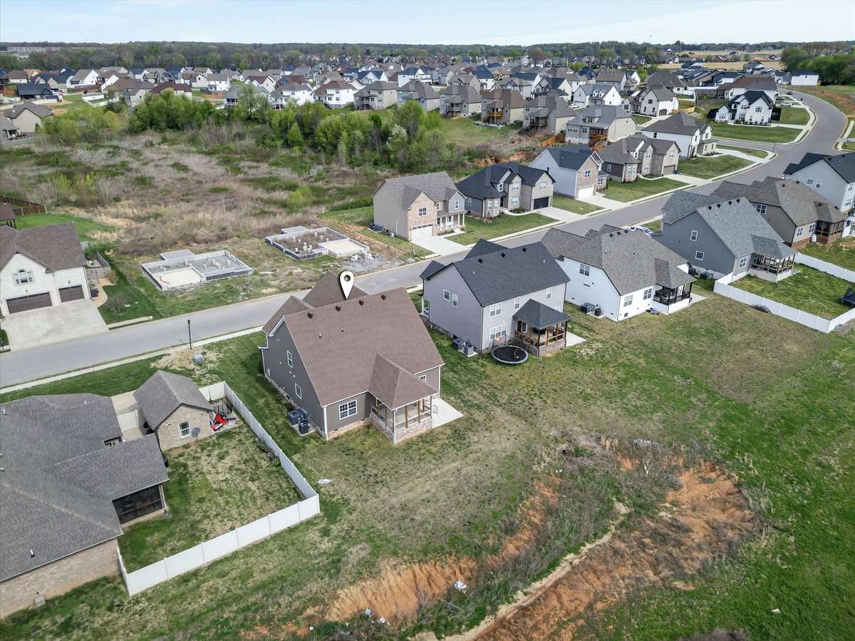 Aerial view highlighting rear of home and lot placement