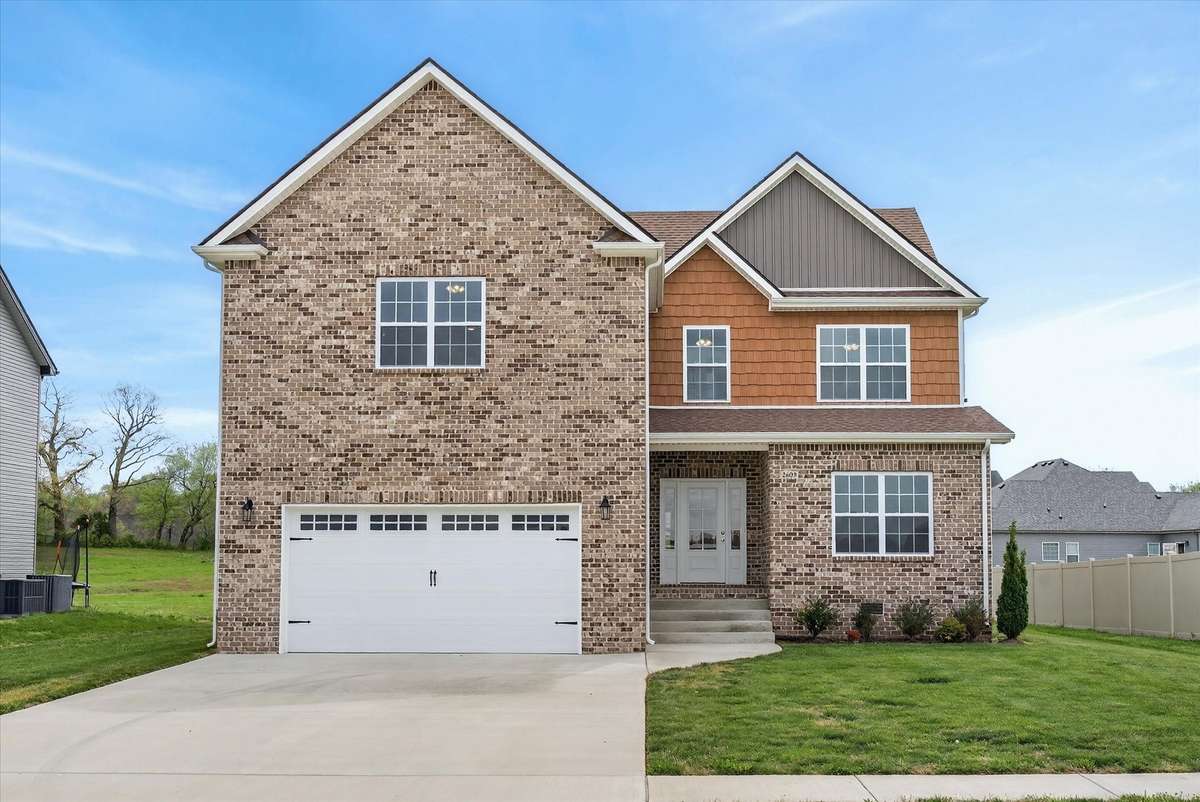 Beautiful two-story home with brick exterior, two-car garage, and great curb appeal.