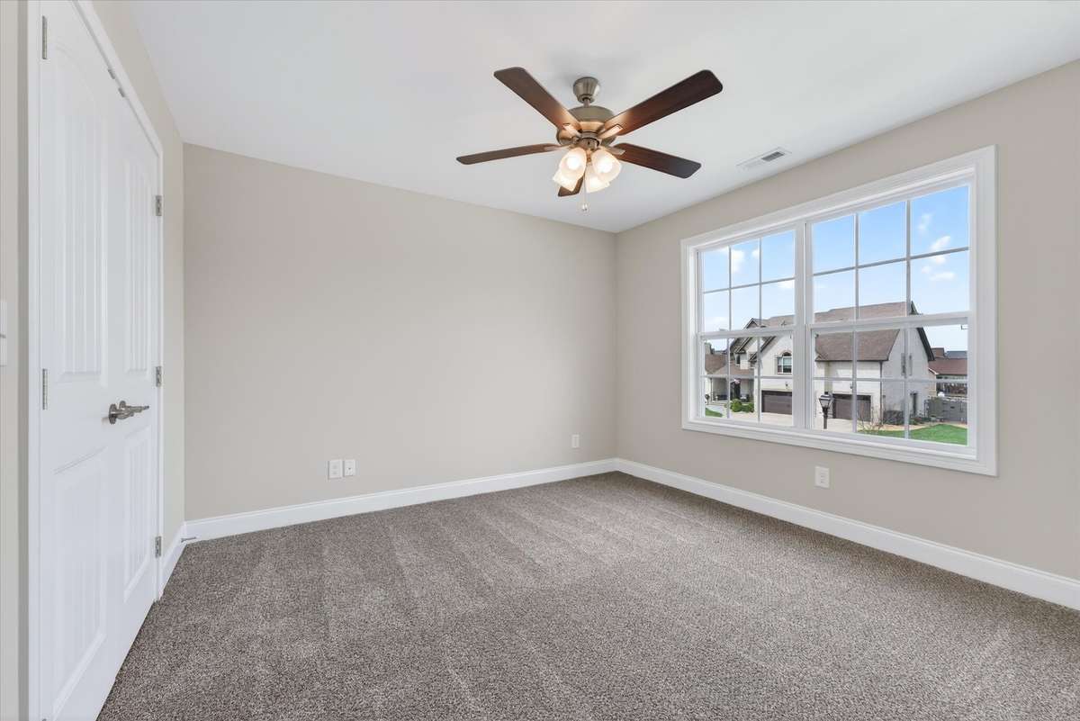 Comfortable secondary bedroom with functional layout