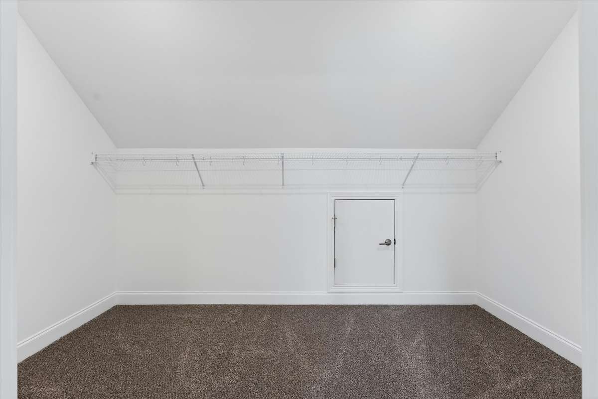 Spacious walk-in closet with built-in shelving