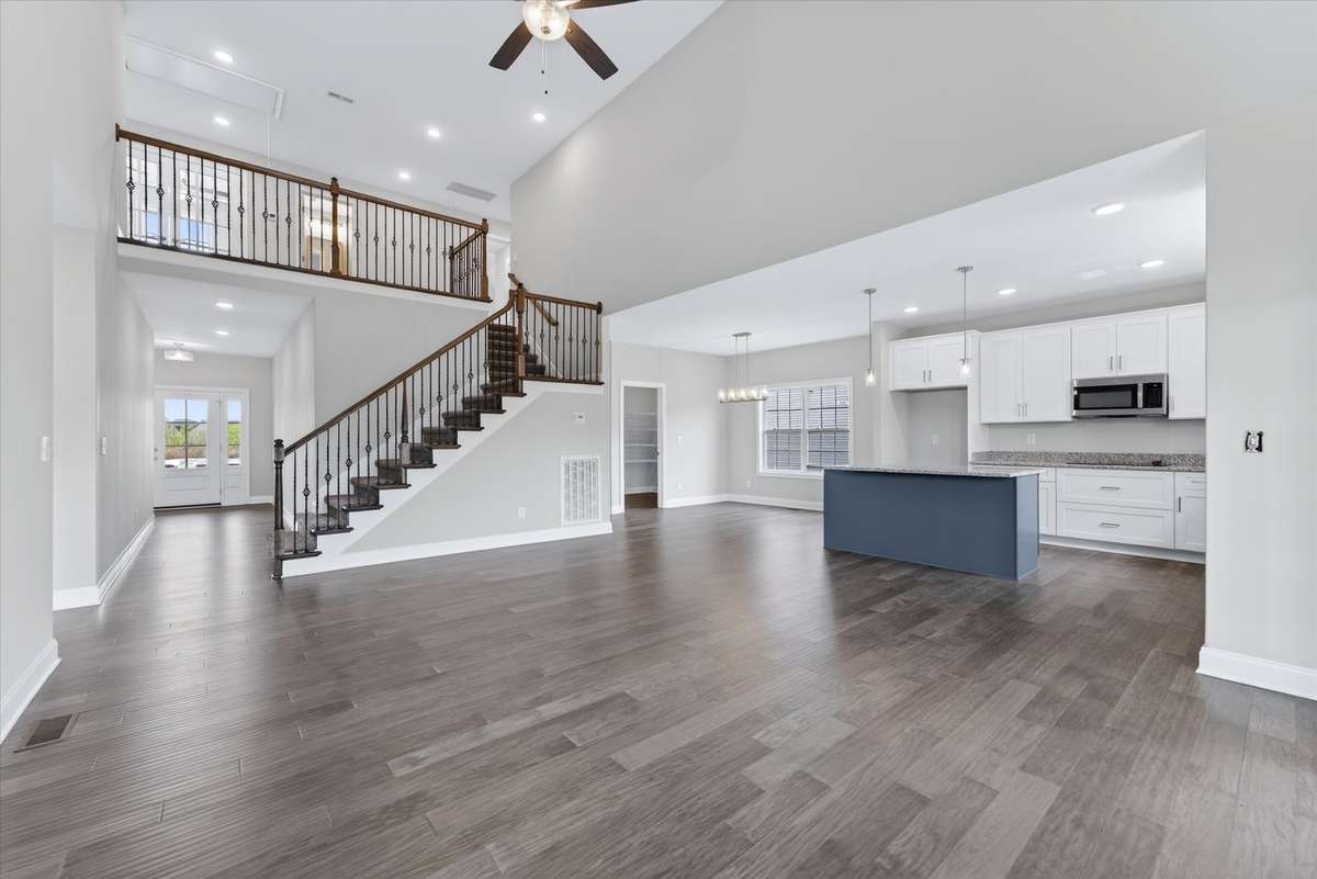 Expansive main living space flowing into kitchen—perfect for entertaining