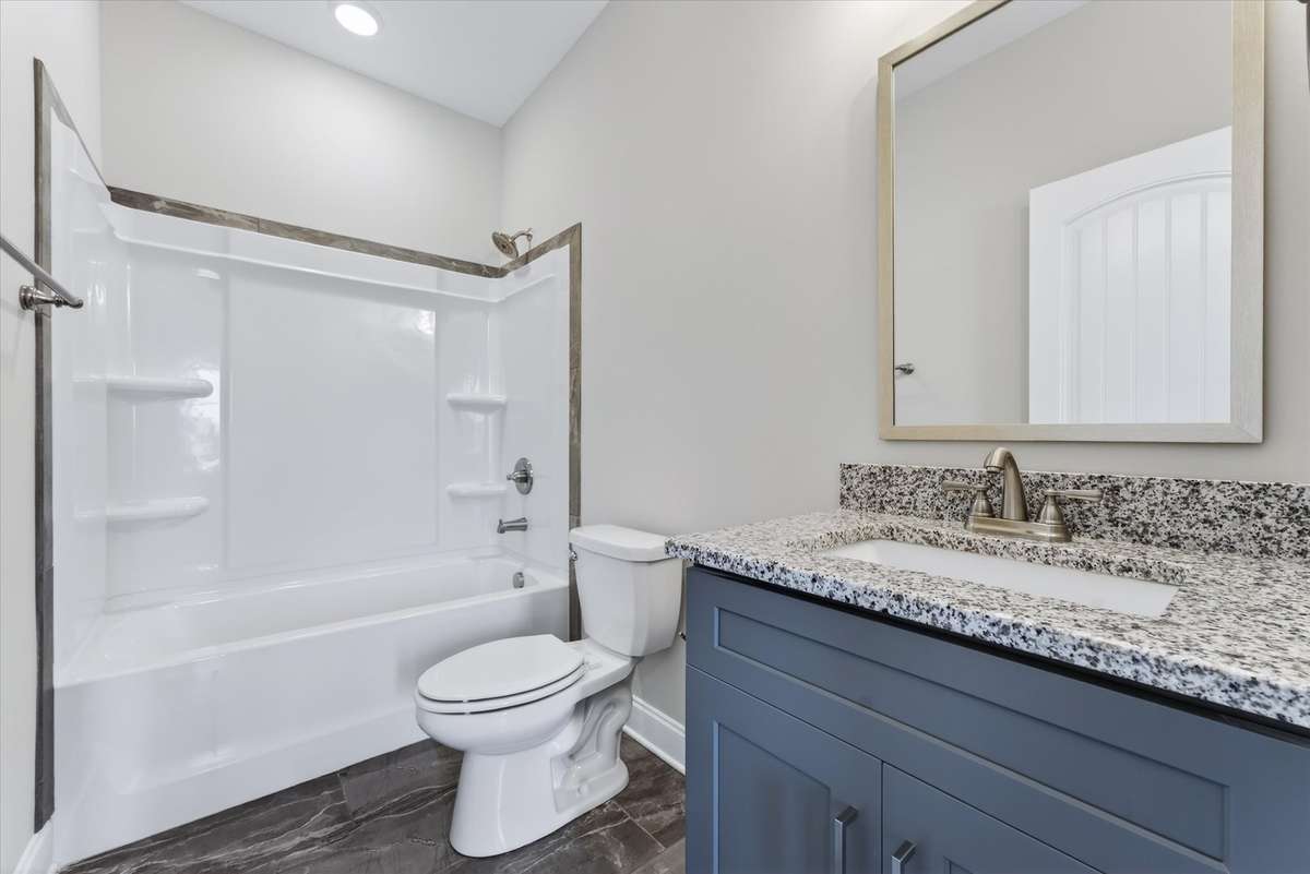 Full bathroom with tub/shower combo and updated finishes