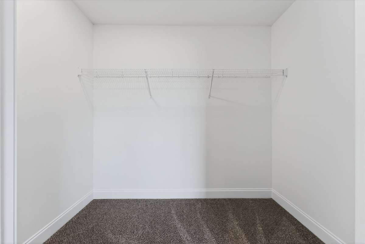 Additional storage space with shelving for organization.
