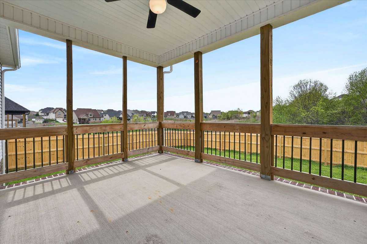 Covered patio with ceiling fan—perfect for relaxing or entertaining.