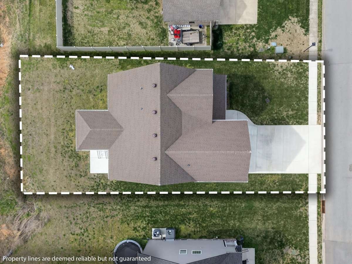 Aerial view highlighting property boundaries and lot layout