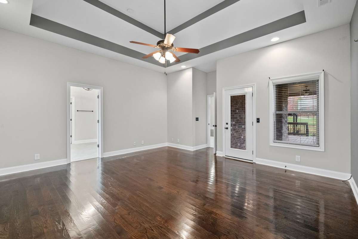 Primary Bedroom Suite Downstairs - exterior door to large covered deck