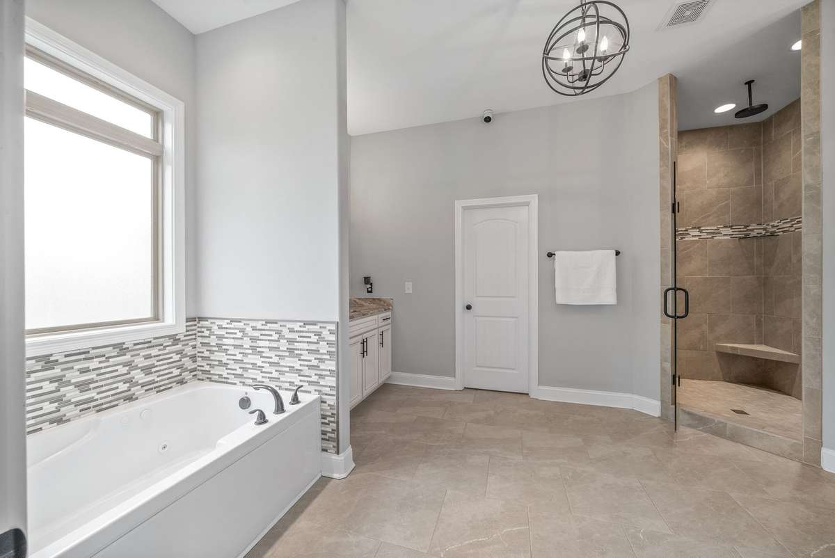 Double vanities w/ granite and HUGE custom tile shower!