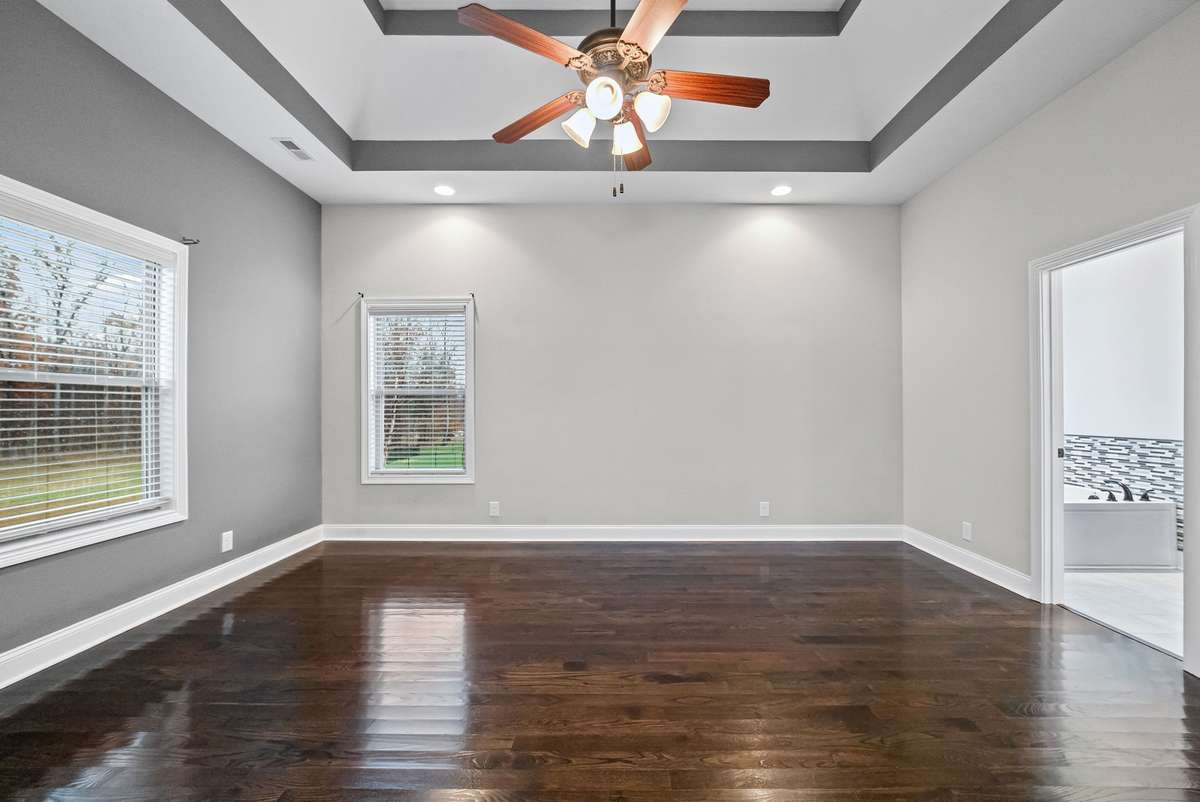 Primary Bedroom w/ gorgeous wood floors!