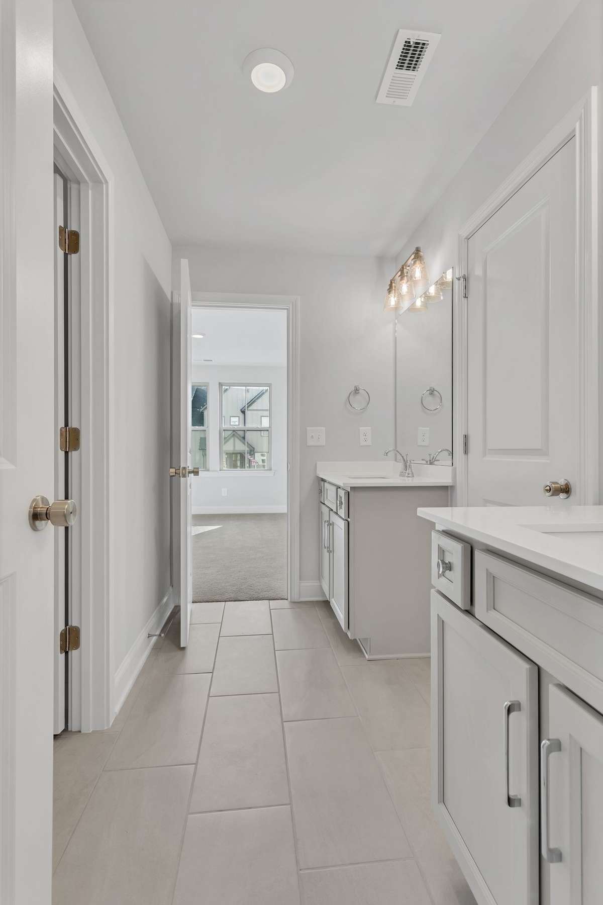 shared bathroom with seperate vanities between bedrooms #3 and #4