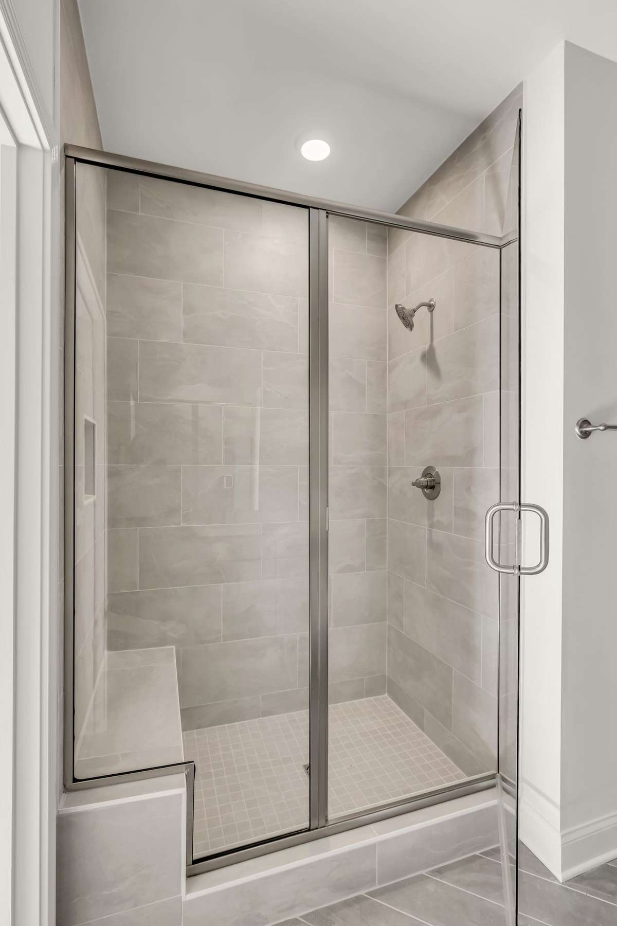 fully tiled shower with bench