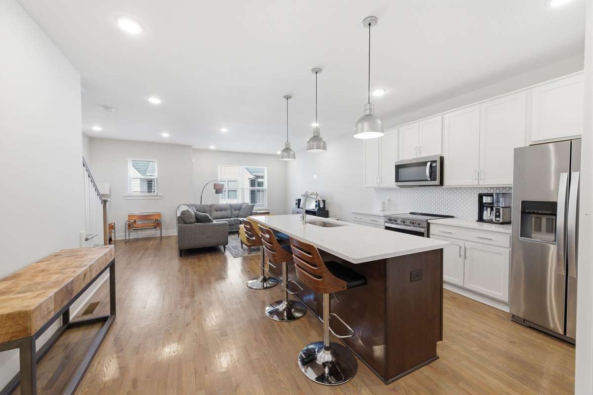 Spacious kitchen. Hardwood floors.