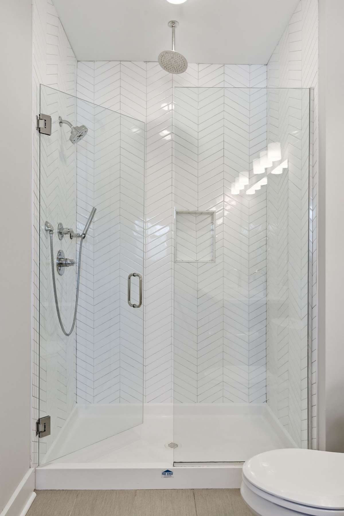 Large shower with 2 shower heads and a wand.
