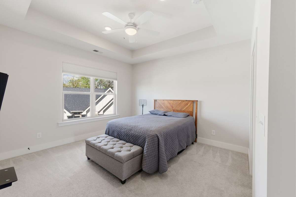 Primary bedroom suite with trey ceiling and walk in closet