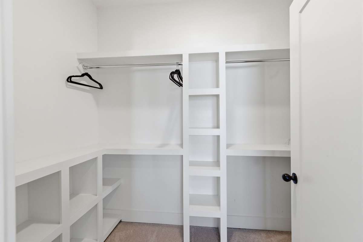 Primary walk in closet.