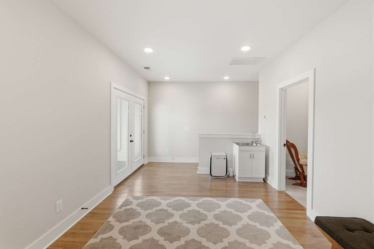 Bonus room on upper level with access to deck and primary bedroom.