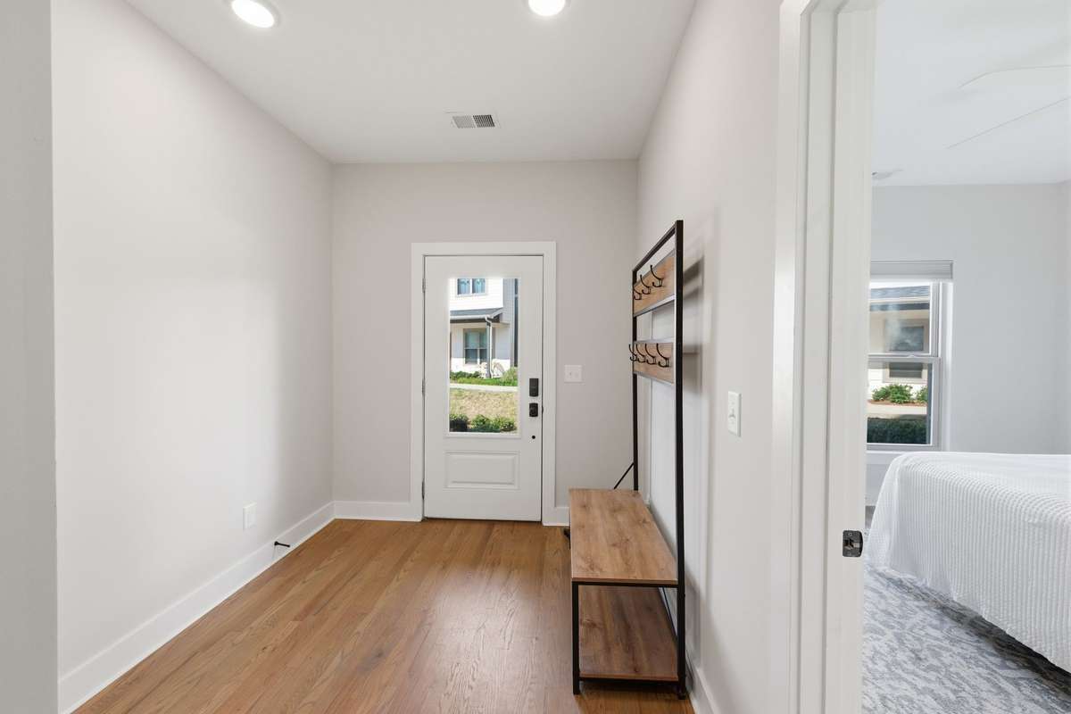 Entry. Beautiful hardwood floors throughout.