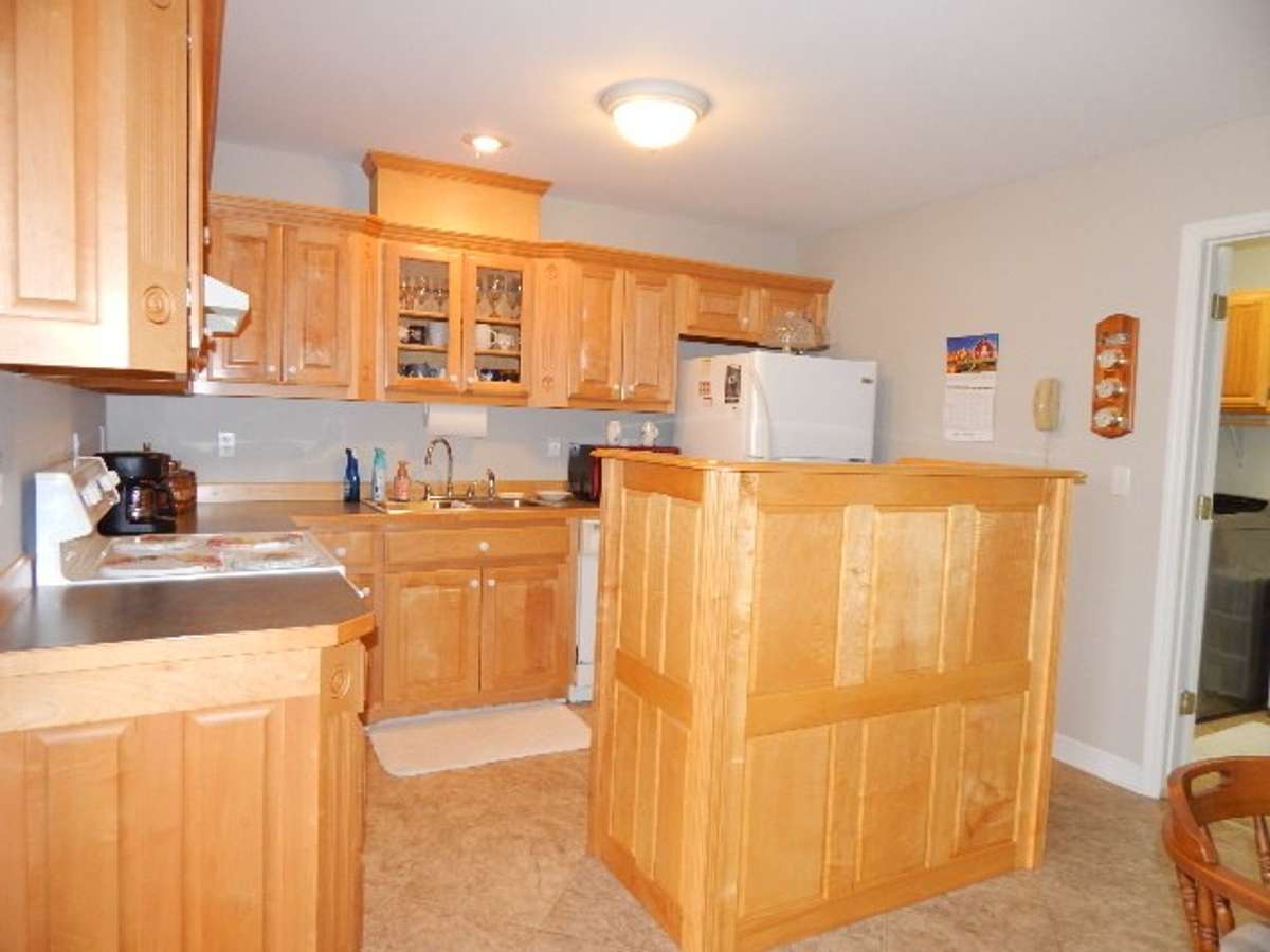 There is a handmade island/cabinet for more workspace and storage