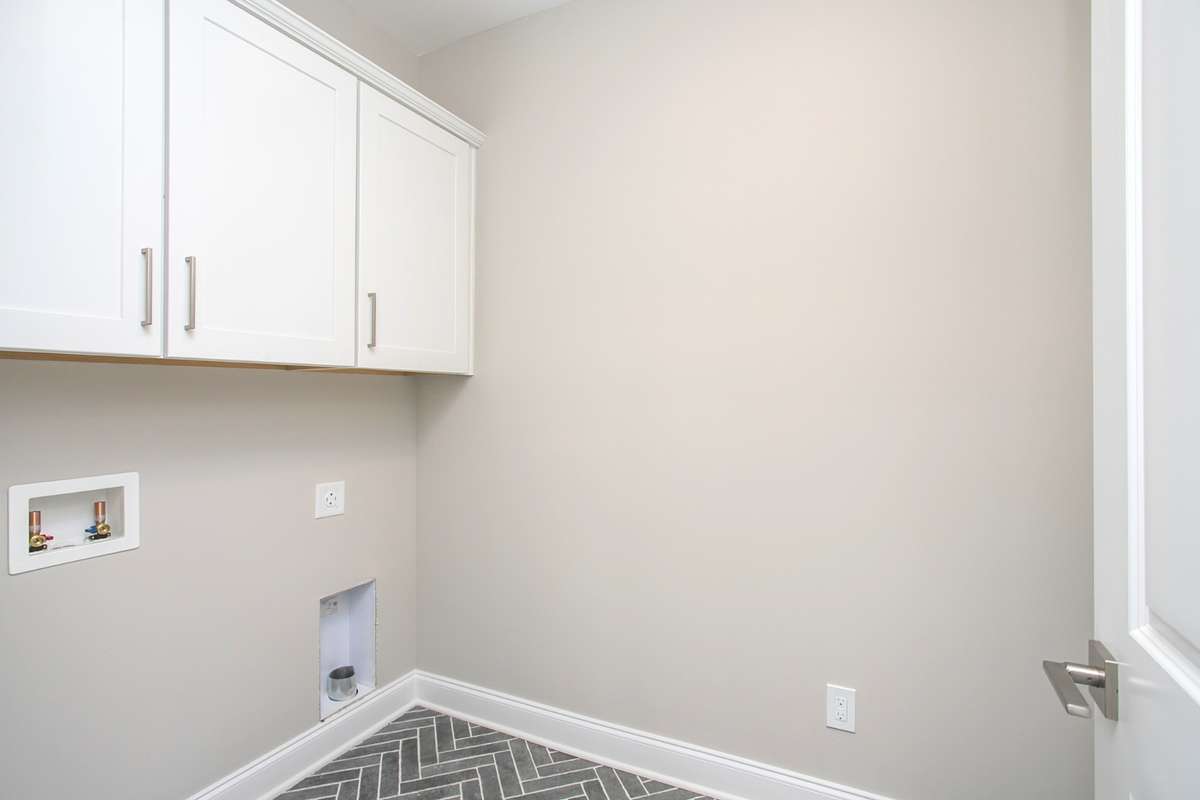 Upstairs Laundry with Built in Cabinets
