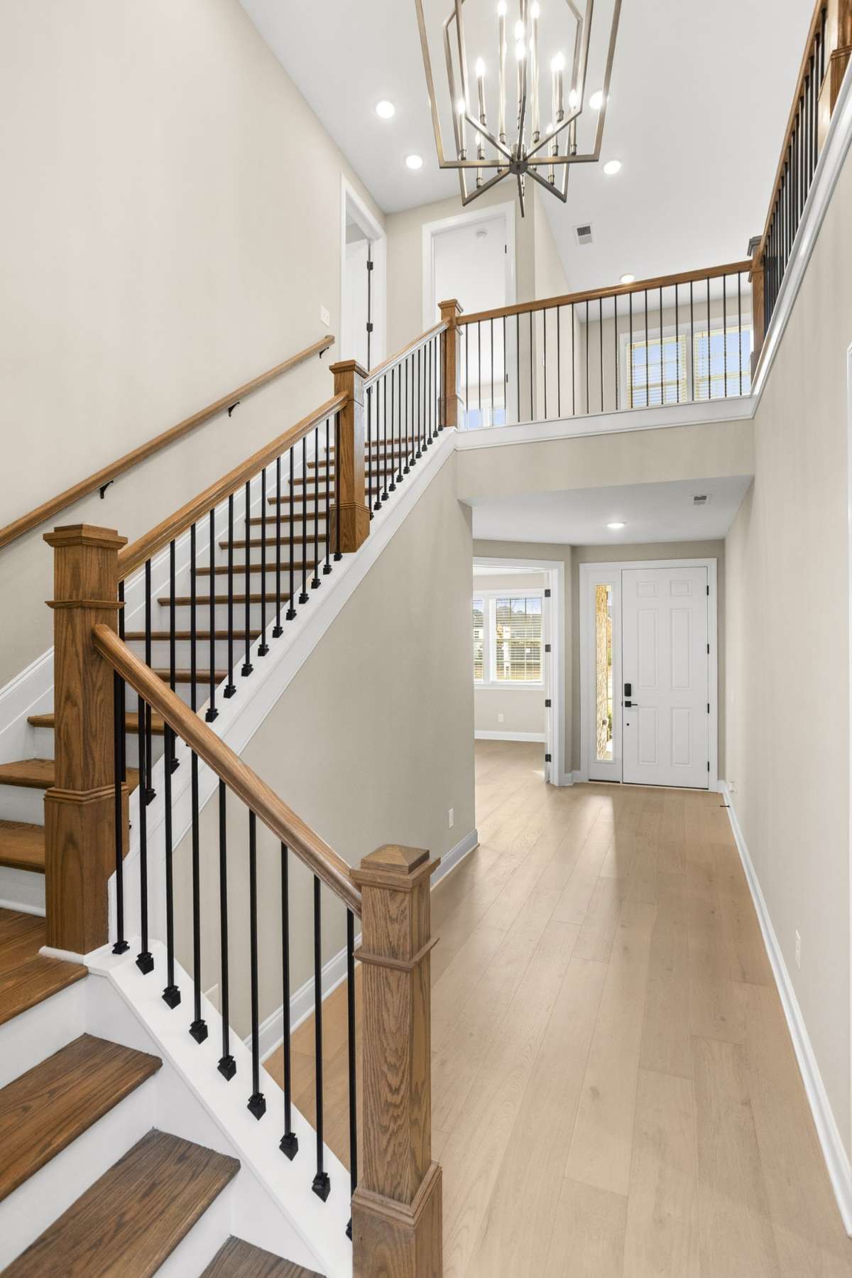 View from Downstairs LIving Room to-Front Entry-Office and Upstairs Den