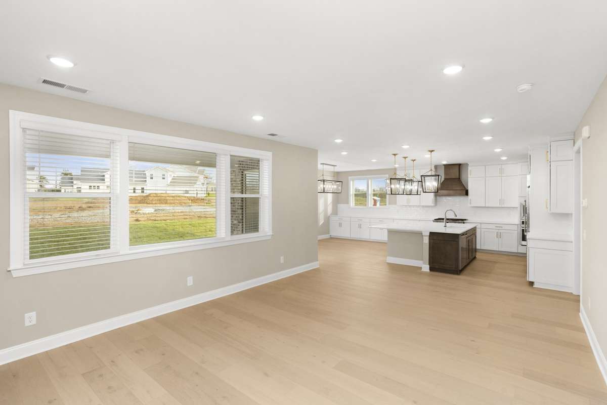 View from Living room into Gourmet Kitchen and Dining Room