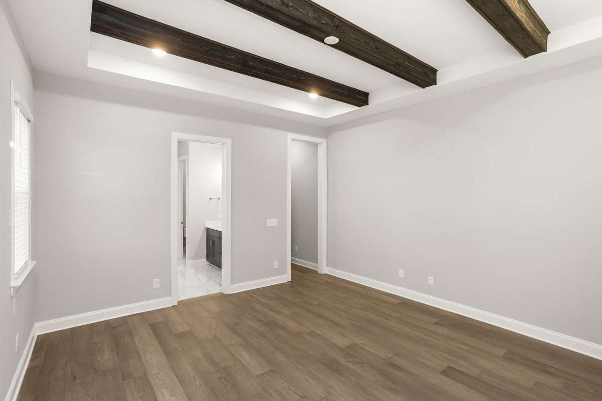 Master bedroom with a view into the master bath