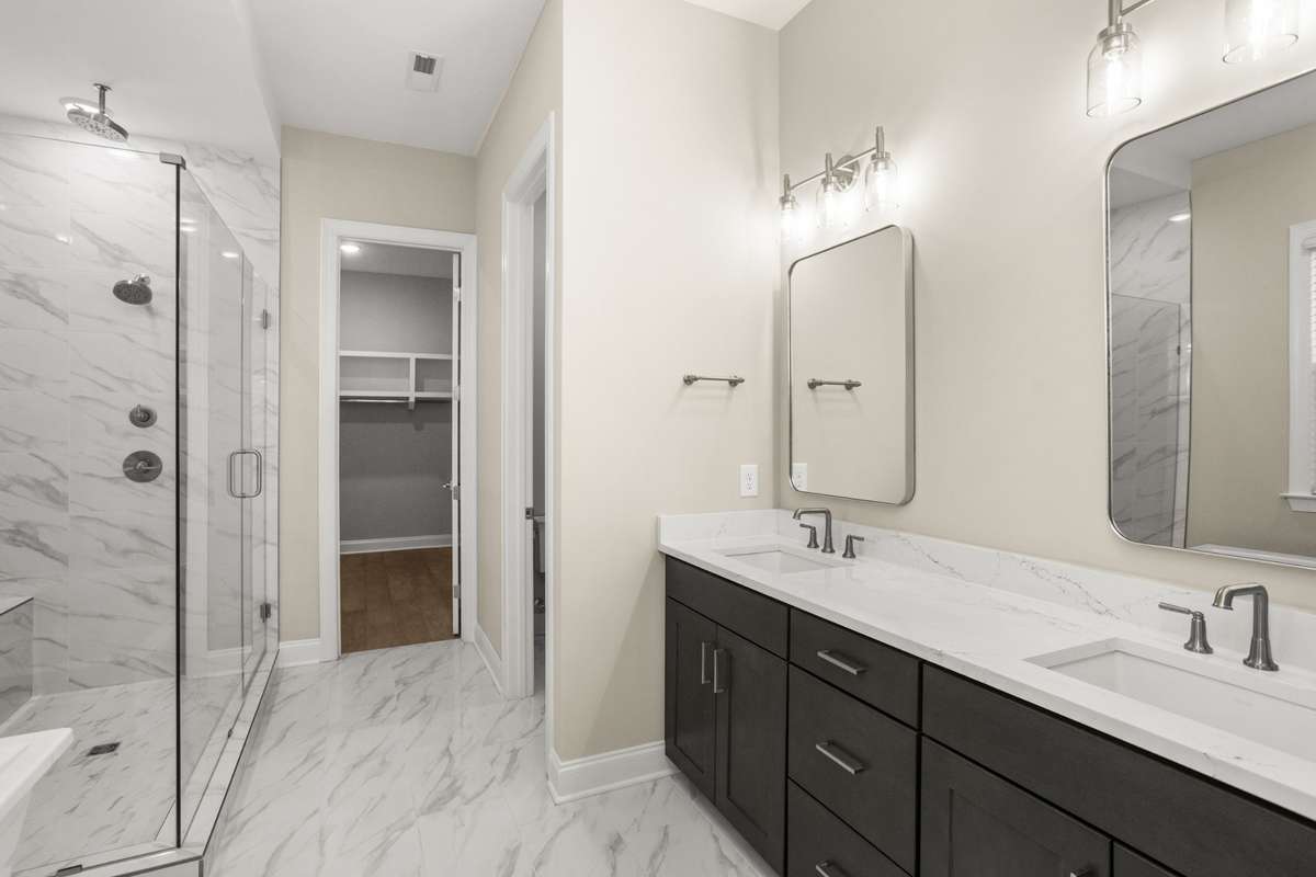 Master bath, with a view into toilet room and master closet