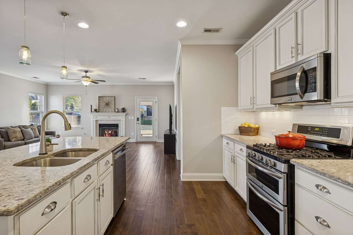 The door to the left leads to the garage, primary bedroom, and laundry area.