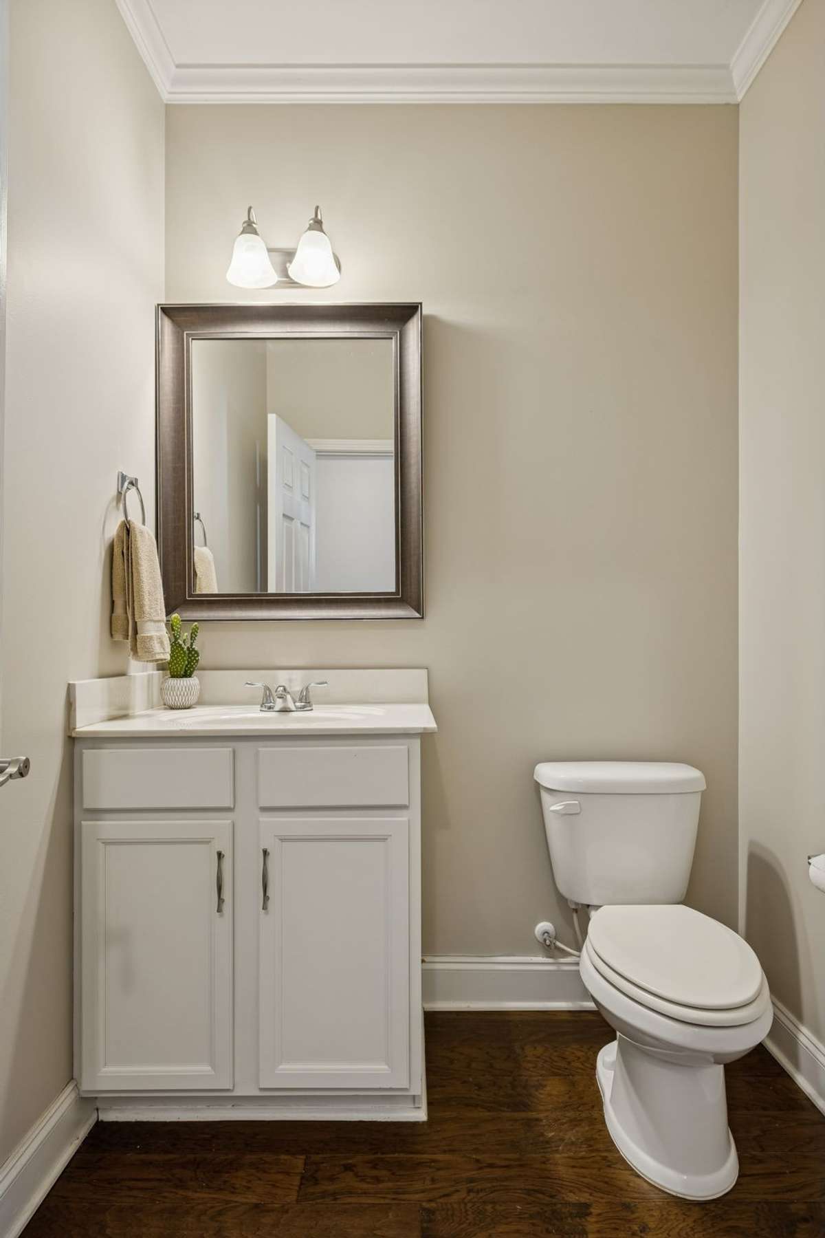 Convenient main-level powder room for guests is off the foyer