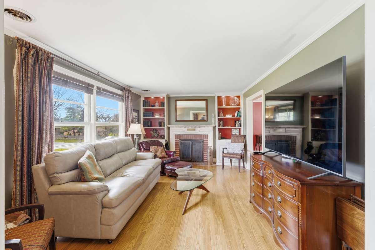 Gorgeous hardwood floors and a wood burning fireplace make this room the focal point of the home!