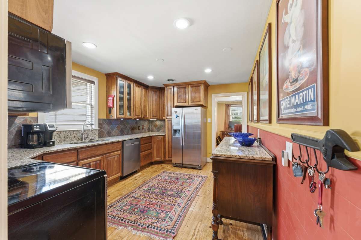 kitchen has tons of counterspace, recessed lighting and located just adjacent to the dining room
