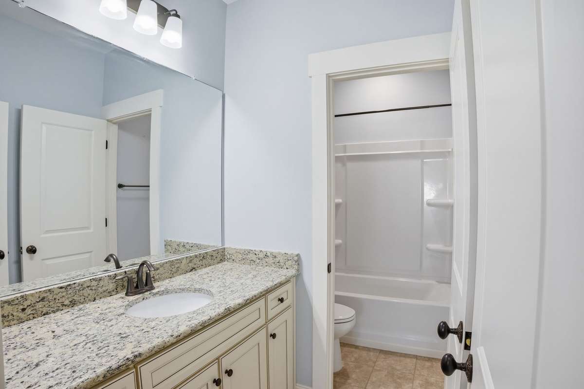 Full bath on the second floor between the two up stairs bedrooms.