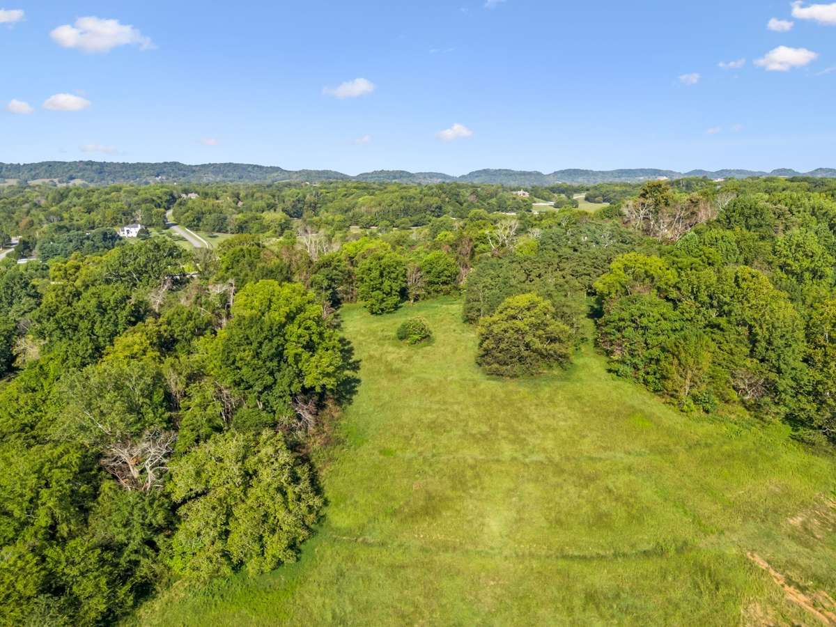 Enjoy breathtakingly high views of the rolling Tennessee hills on this picturesque 5-acre private estate