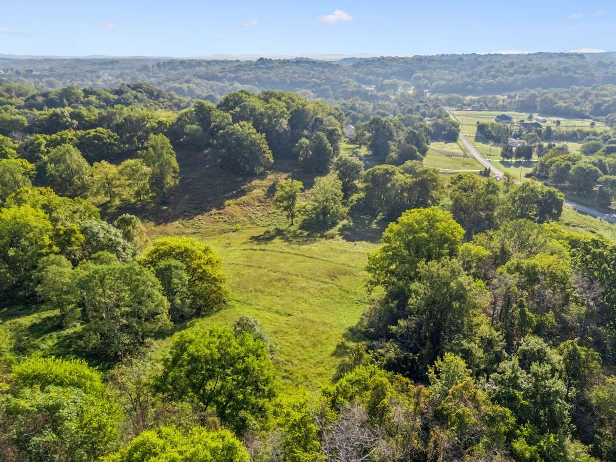 Enjoy breathtakingly high views of the rolling Tennessee hills on this picturesque 5-acre private estate