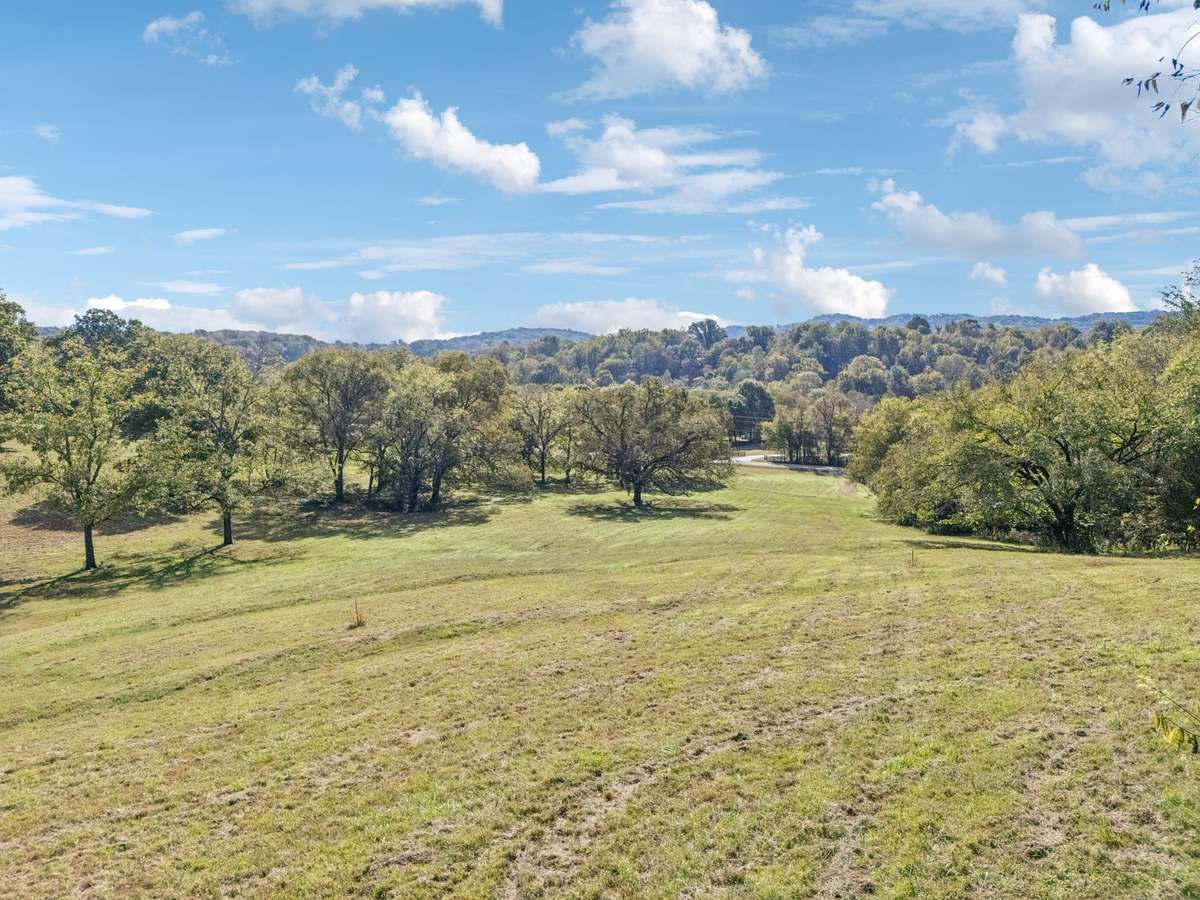 Enjoy breathtakingly high views of the rolling Tennessee hills on this picturesque 5-acre private estate
