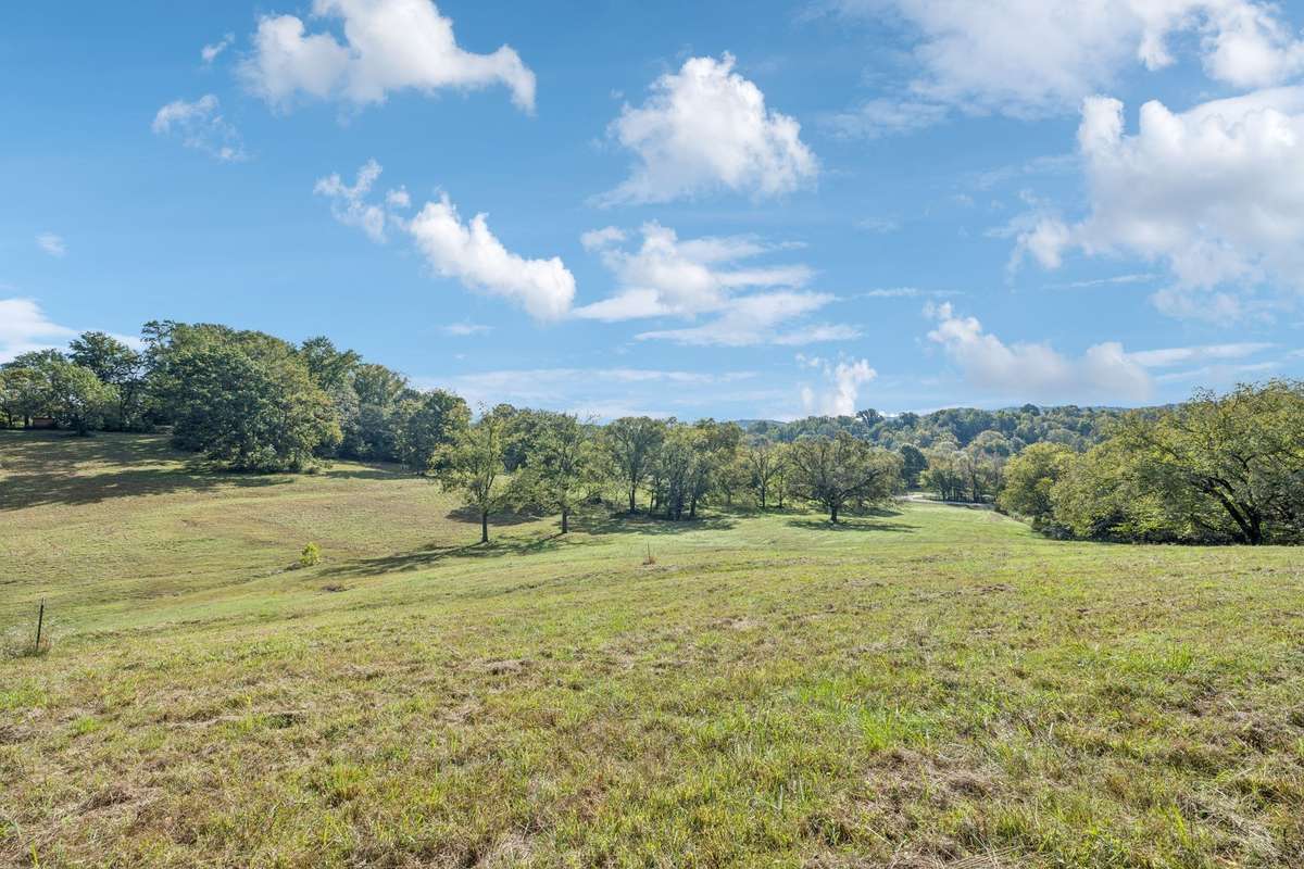 Enjoy breathtakingly high views of the rolling Tennessee hills on this picturesque 5-acre private estate