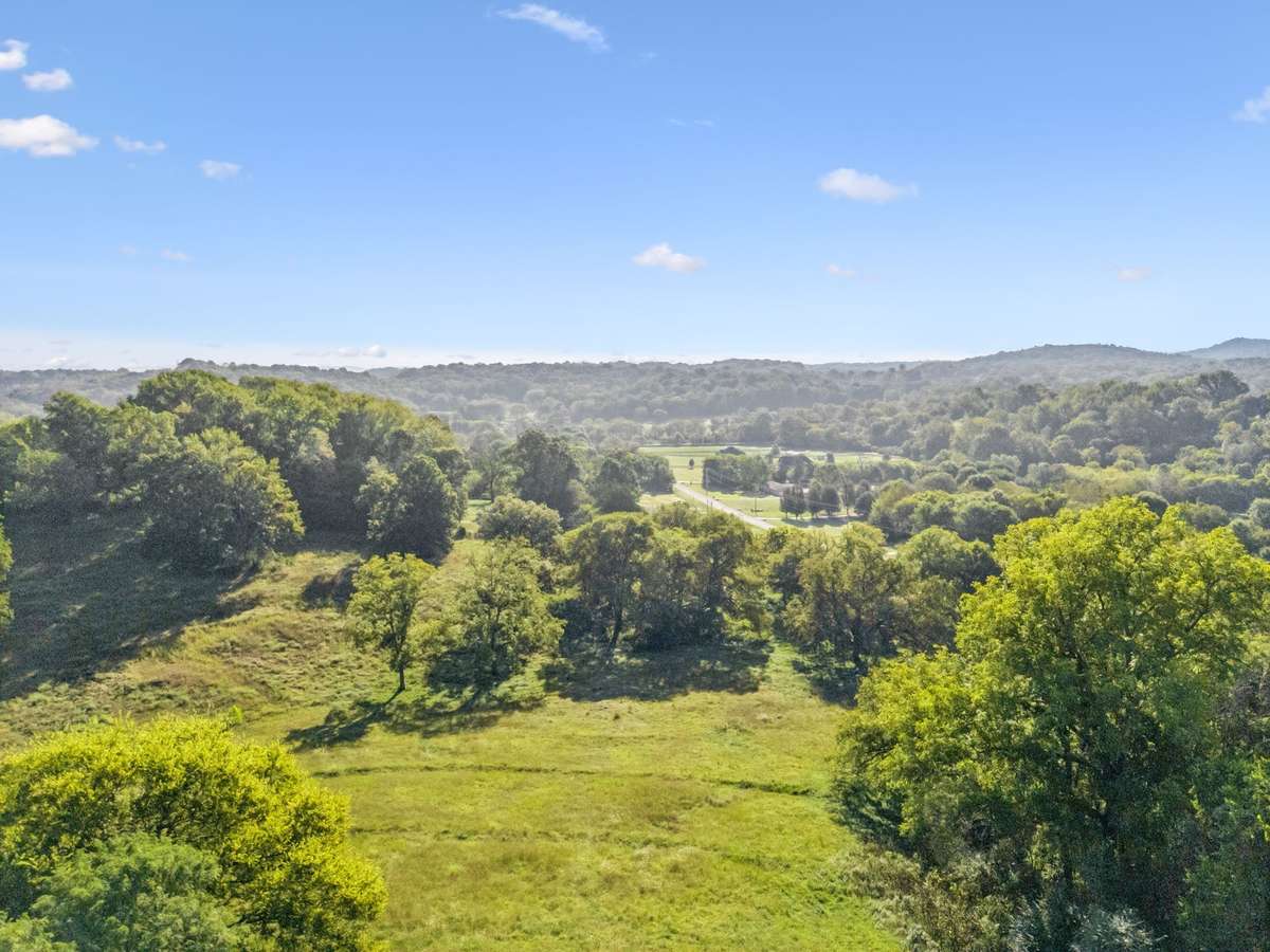 Enjoy breathtakingly high views of the rolling Tennessee hills on this picturesque 5-acre private estate.