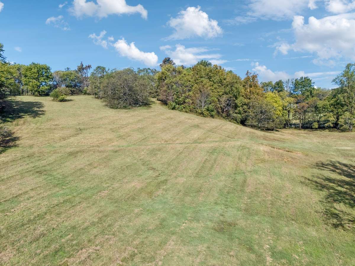 Enjoy breathtakingly high views of the rolling Tennessee hills on this picturesque 5-acre private estate