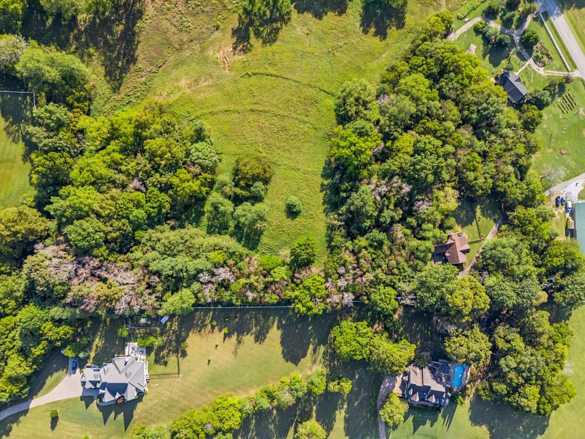 Enjoy breathtakingly high views of the rolling Tennessee hills on this picturesque 5-acre private estate